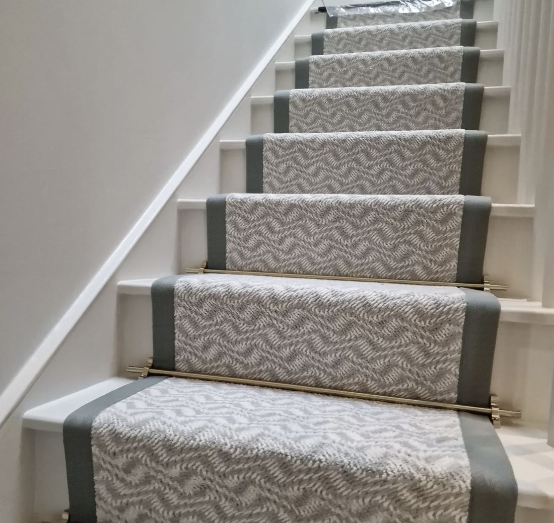 Herringbone stair runner with a sage cotton border and brass stair rods, Chelsea SW3