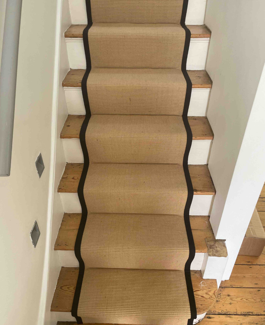 Golden sisal with black cotton edge on stairs