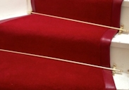 A picture of a red stair runner in Soho