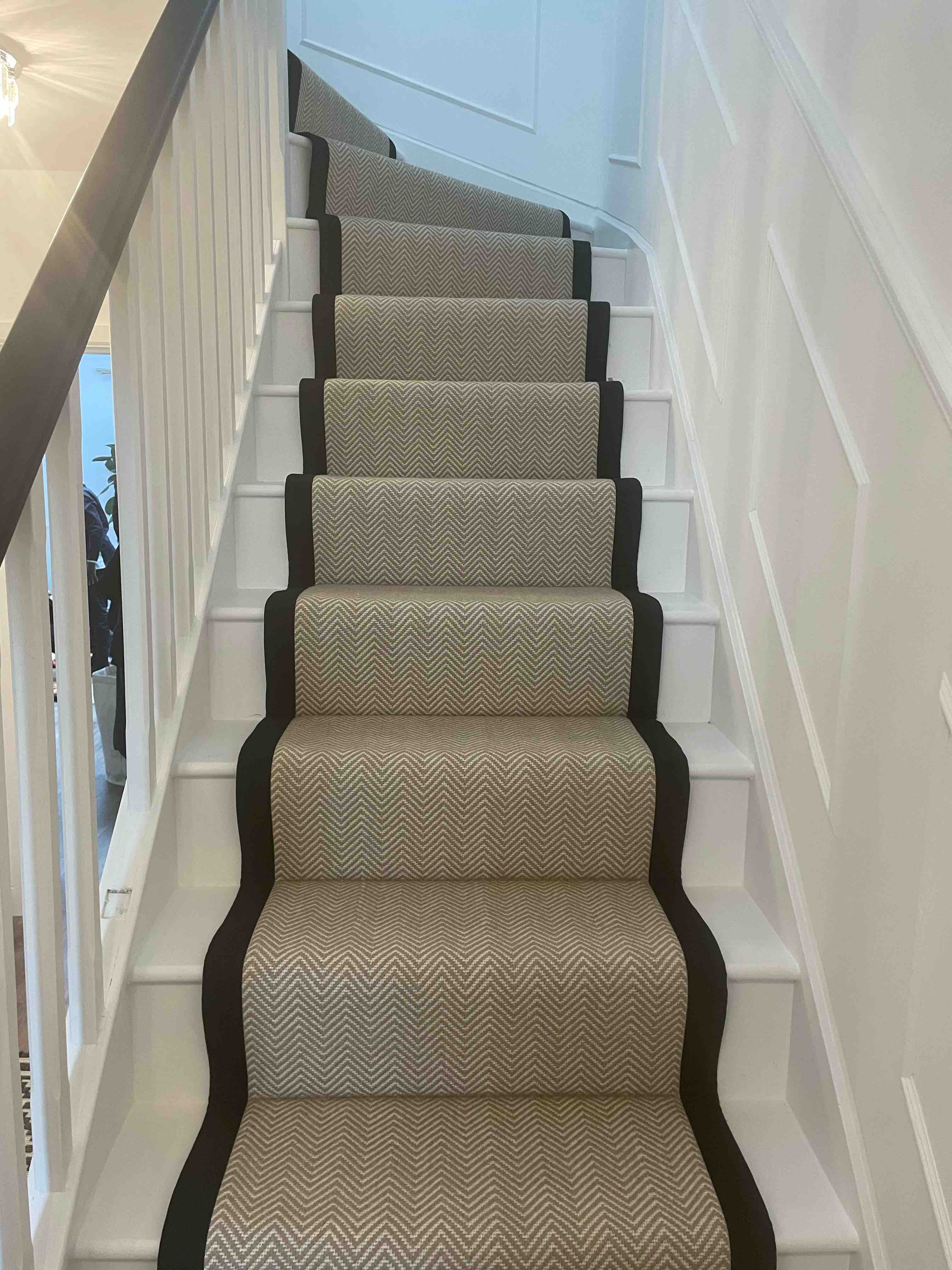 Champagne herringbone stair runner with a brown cotton border