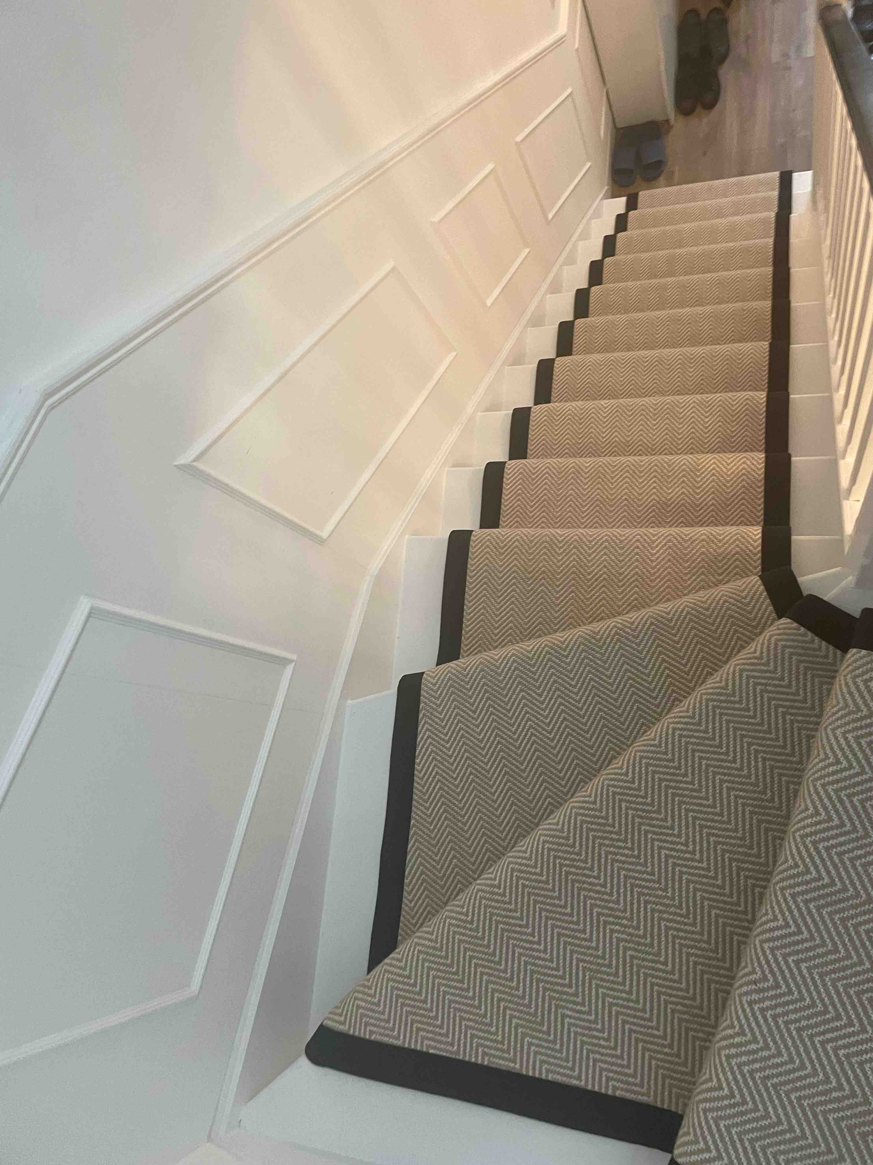 Champagne herringbone stair runner with a brown cotton border