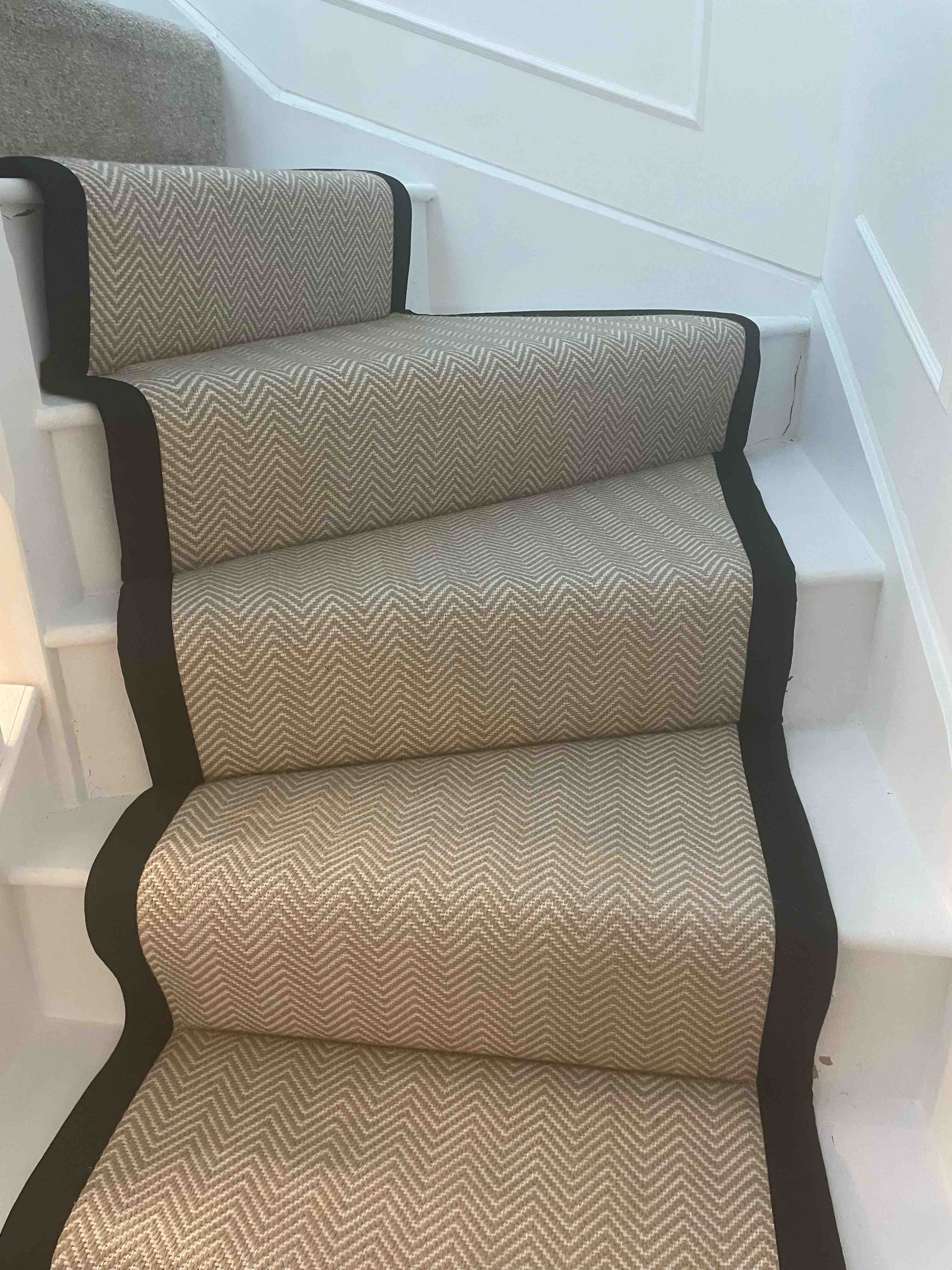 Champagne herringbone stair runner with a brown cotton border