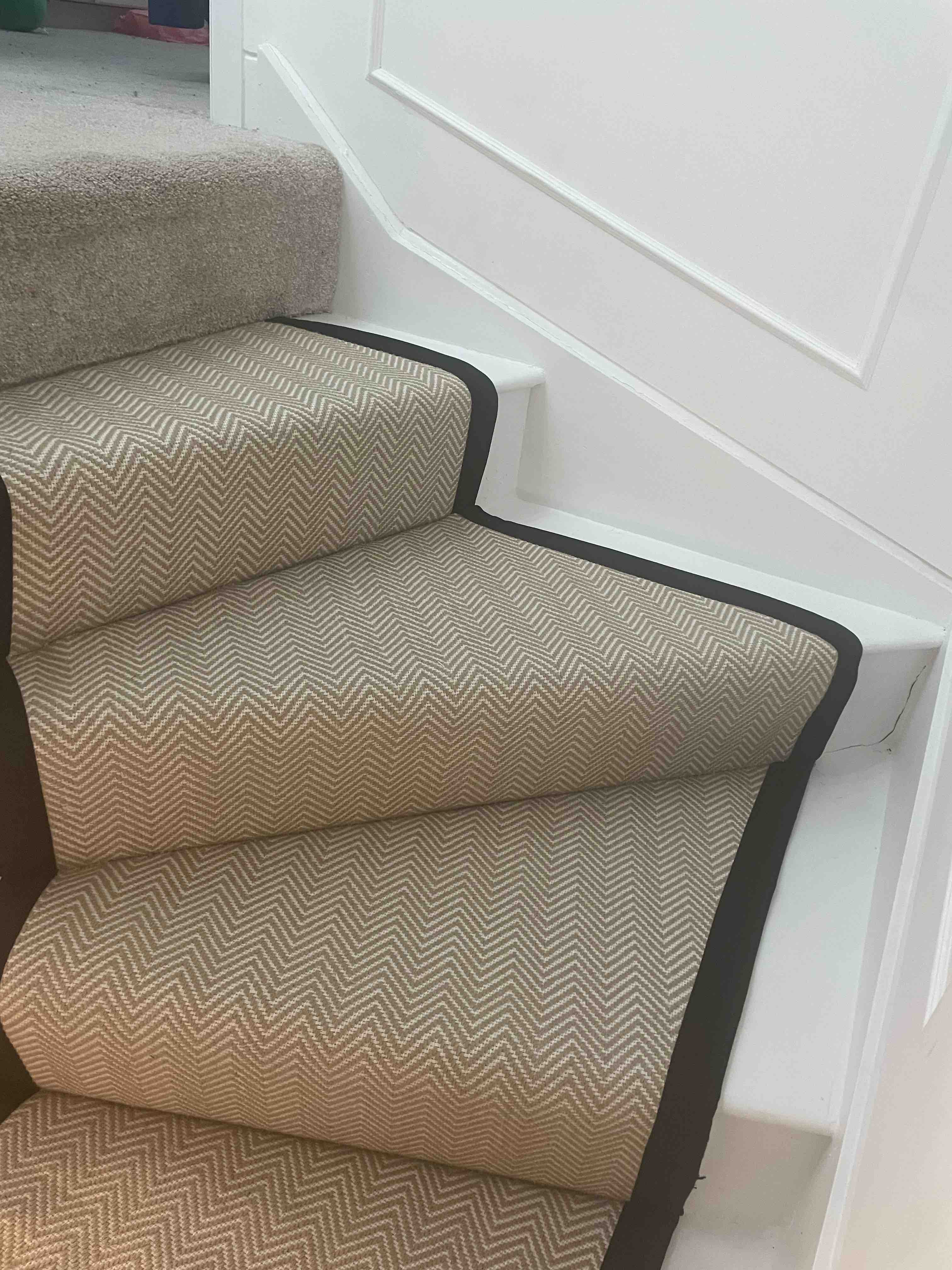 Champagne herringbone stair runner with a brown cotton border