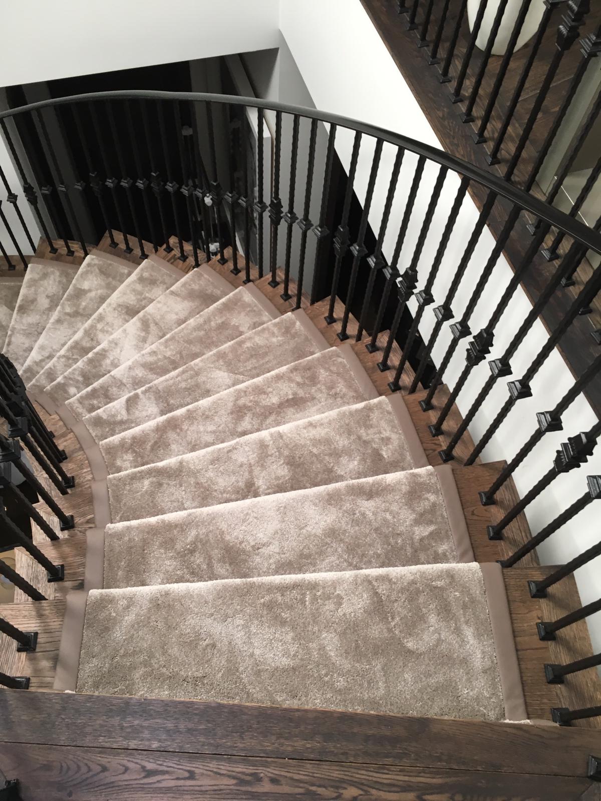 Bespoke stair runner fitted to a grand curved staircase, Mayfair W1