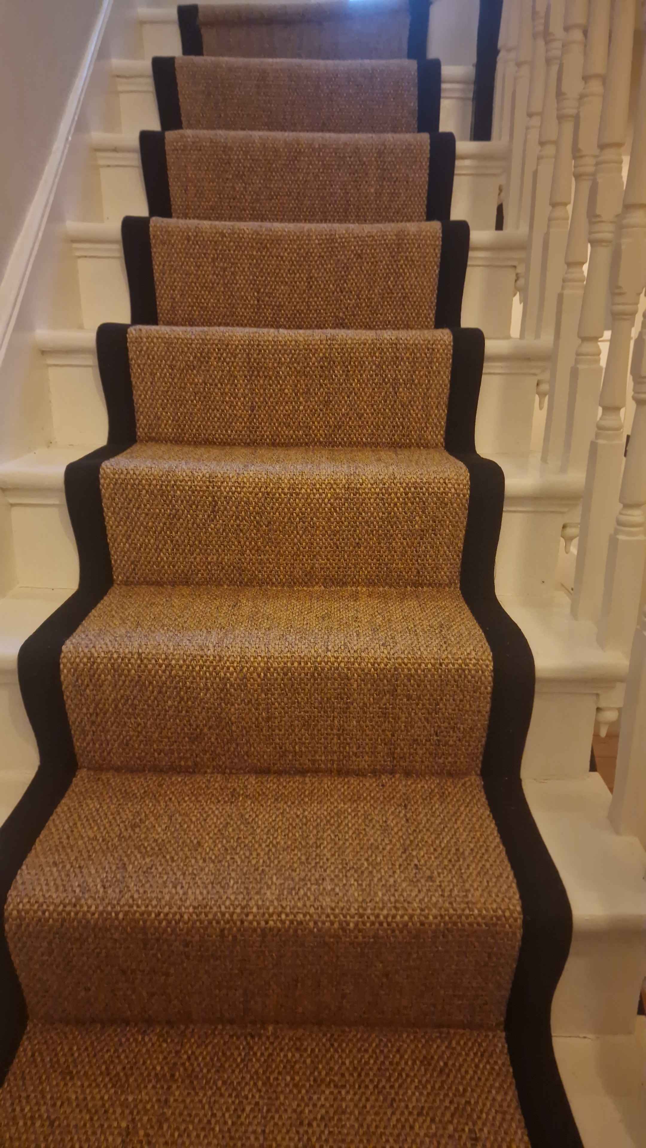 Sisal bouclé stair runner with a black cotton border